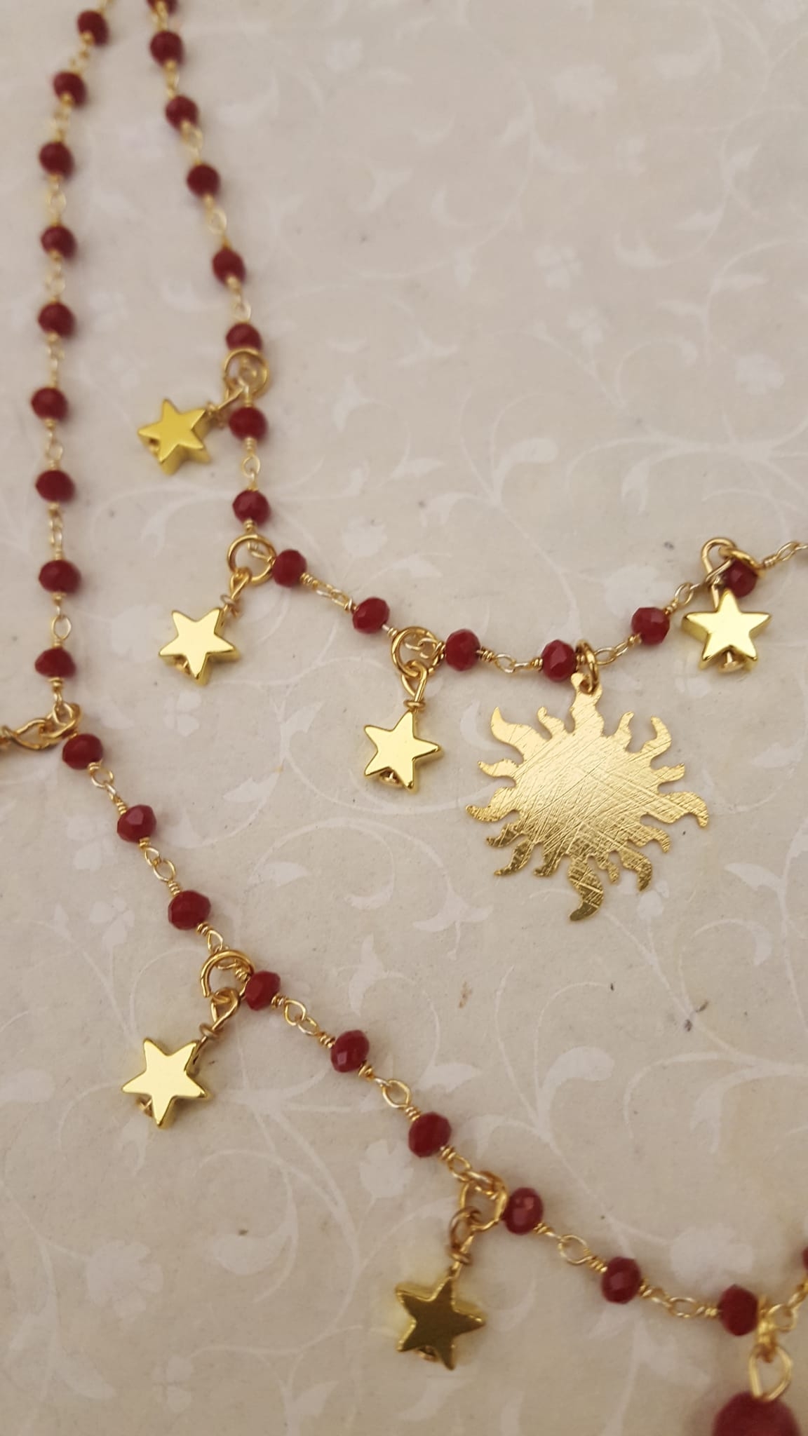 collana sole luna pietre rosse
