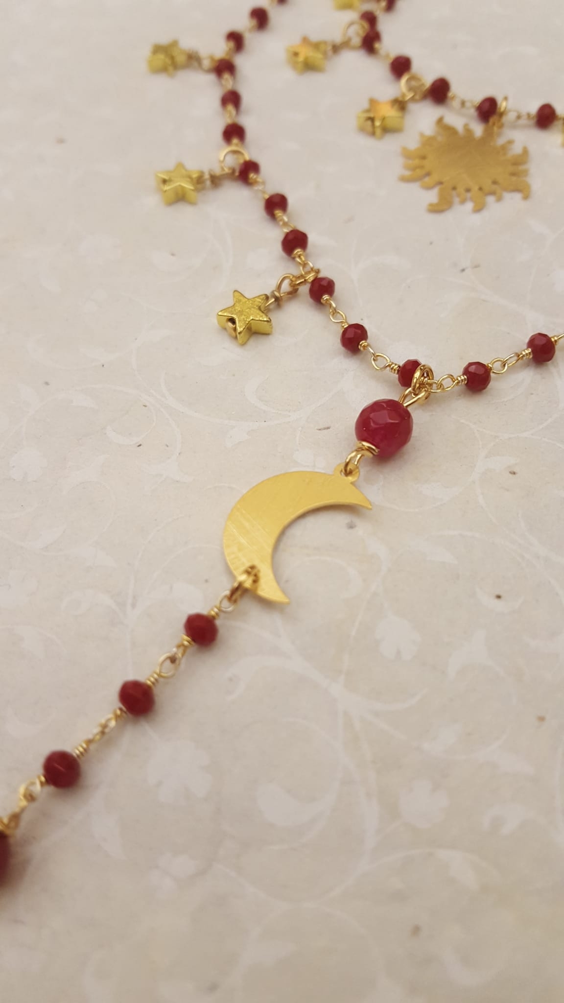 collana sole luna pietre rosse